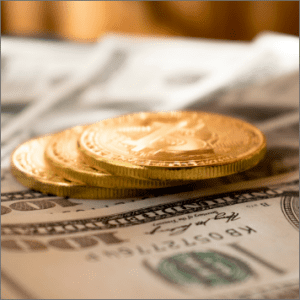 Gold coins and cash at Ideal Jewelry and Loan pawn shop for top dollar payouts.