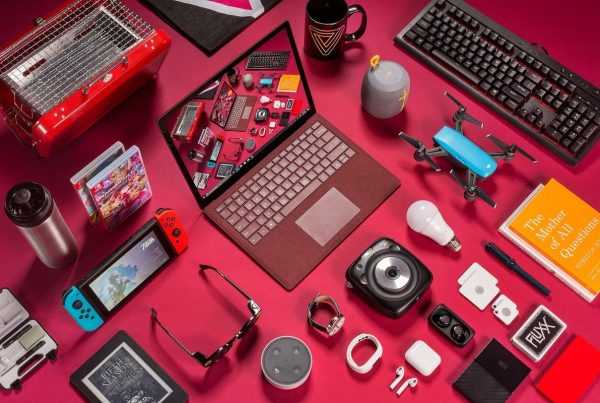 Gold jewelry and coins on top of U.S. dollar bills