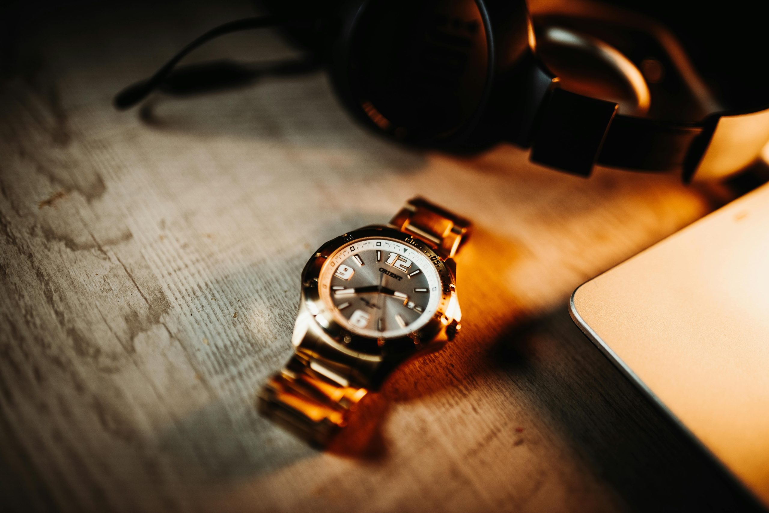 Close-up of luxury watches in a blue and tan leather case, showcasing premium timepieces considered for pawning or selling