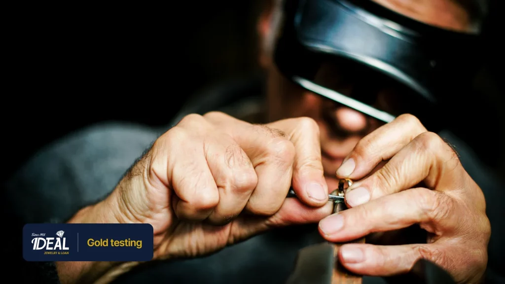 A jeweler examining a small ring under magnification